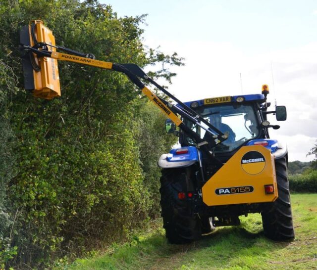 Large Tractor with Mounted Side Arm Flail